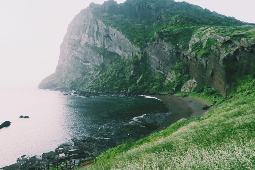 Sunrise Peak and a black sand beach on Jeju Island