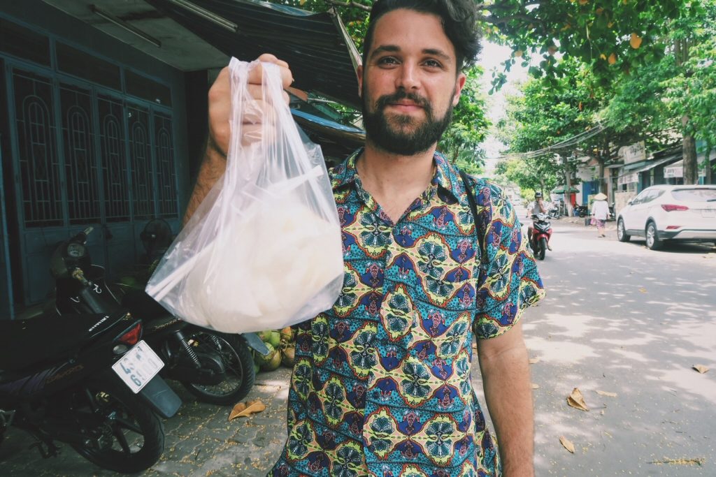 Ben with coconut juice in Da Nang, Vietnam
