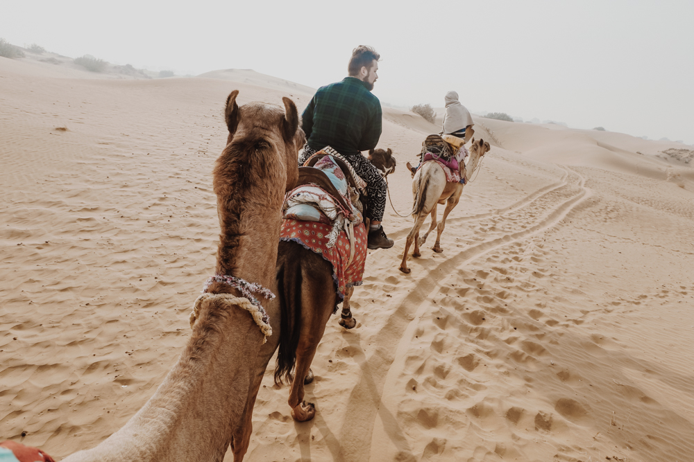 Riding a camel in India, Rajasthan on a Jaisalmer camel safari