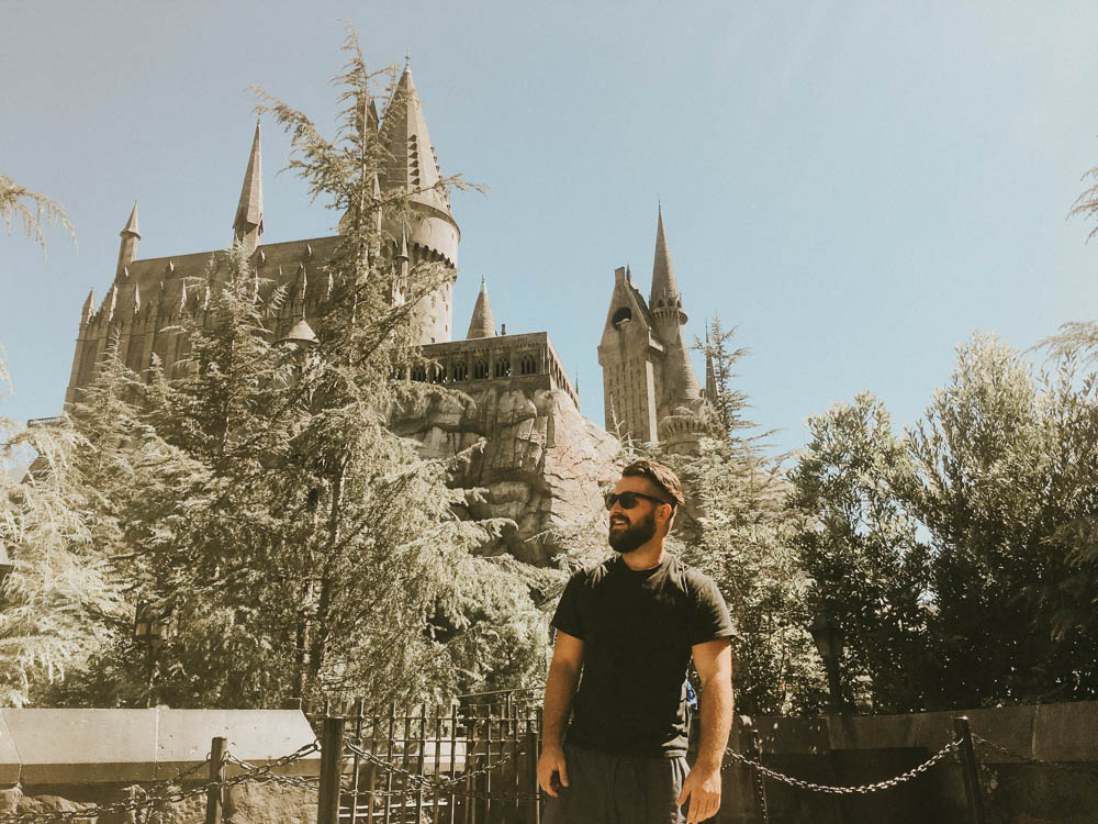 Ben standing in front of Hogwarts Castle at Universal Studios Los Angeles